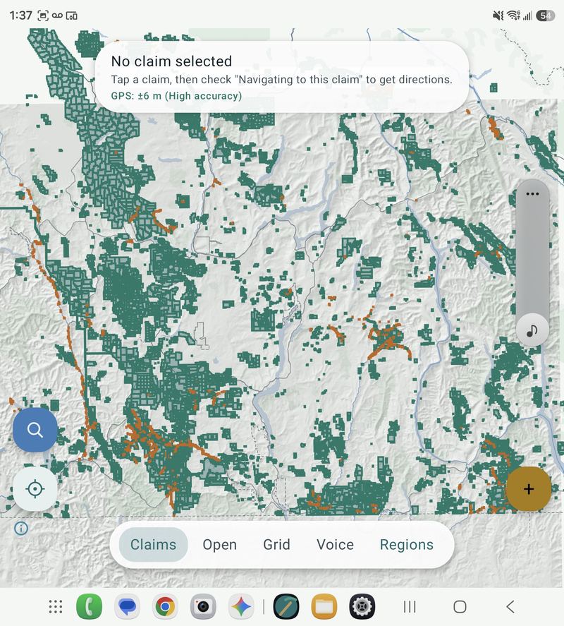 Map view with mineral and placer claims overlaid in teal and orange